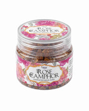 Rose camphor fragrance jar with floral label, clear lid, and amber crystal pieces