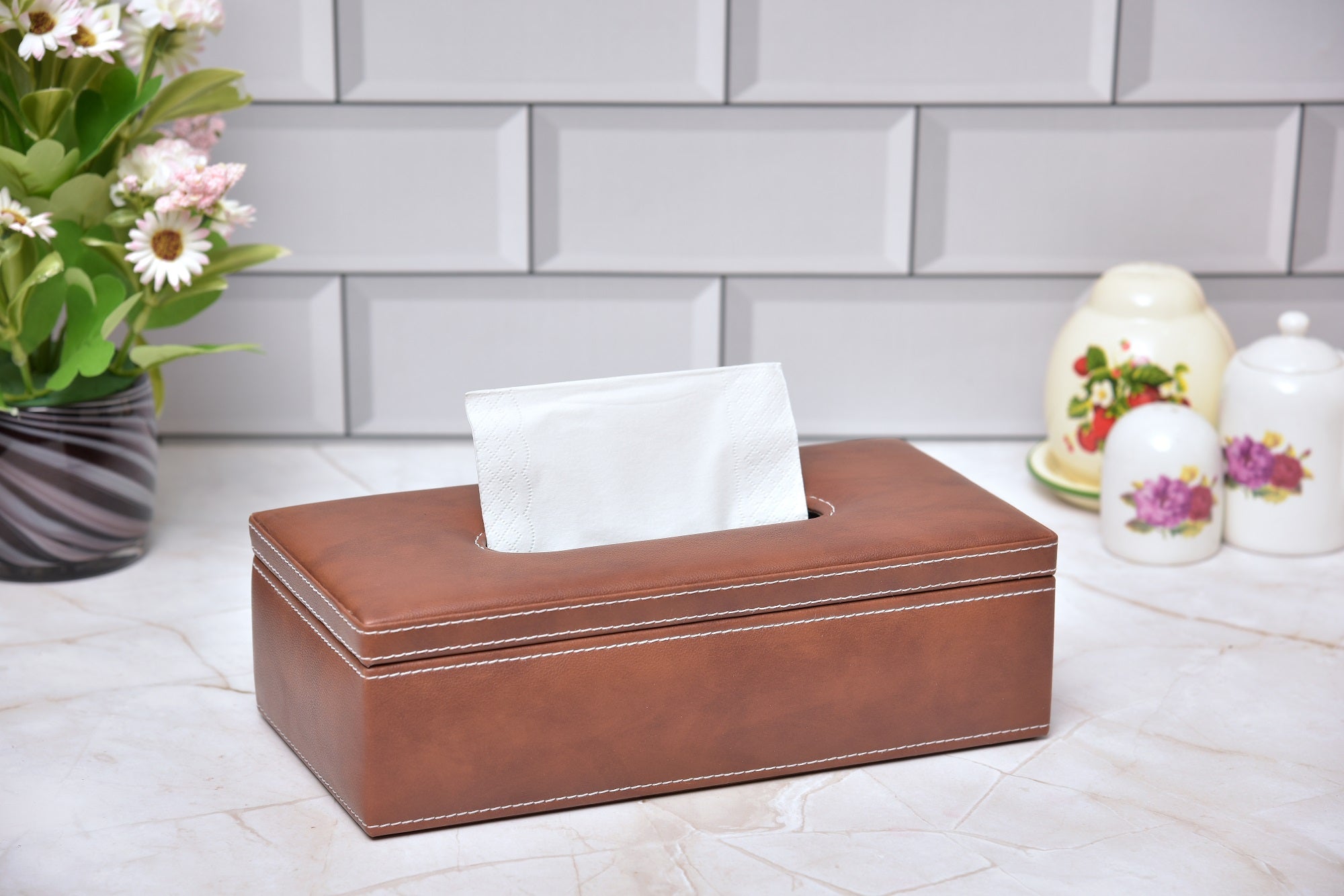 Rectangular tissue holder in medium brown leatherette with white tissues, open top