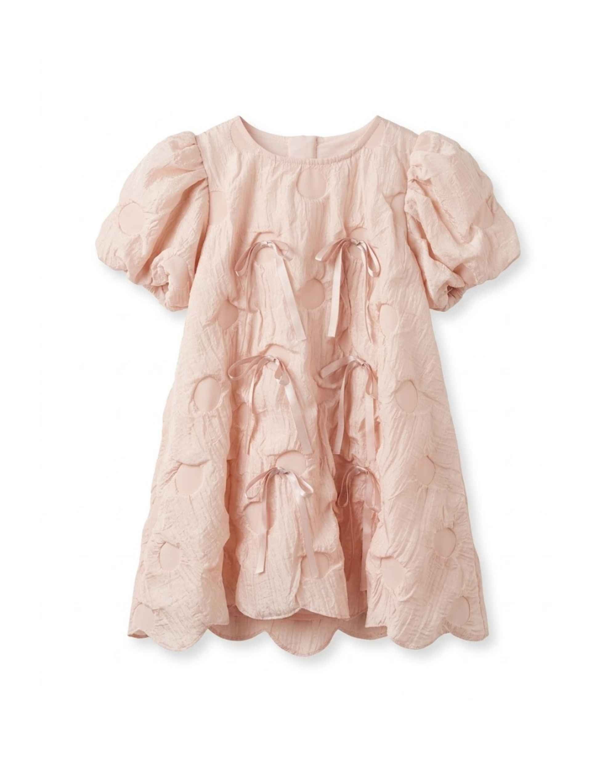 Blush pink textured girls dress with puff sleeves, round neckline, and drawstring bow
