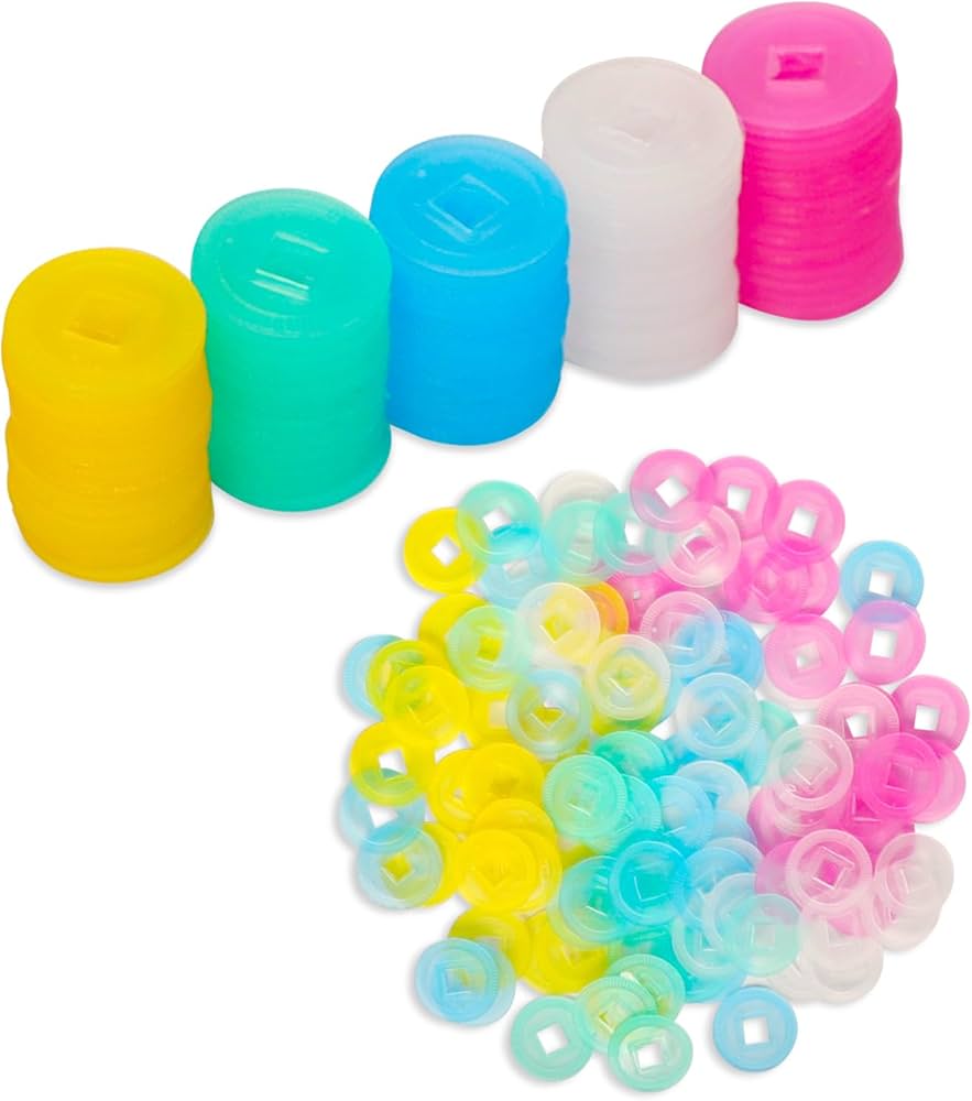 Stacked and scattered round translucent mahjong scoring chips in bright colors