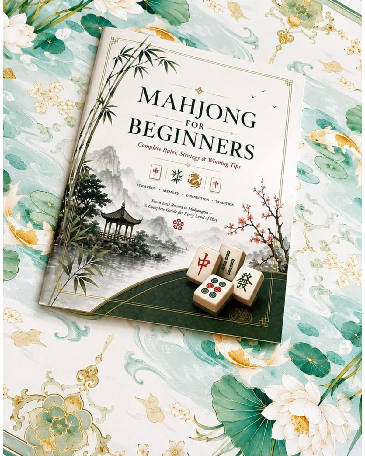 Mahjong for Beginners guide book with bamboo and mountains cover, with mahjong tiles