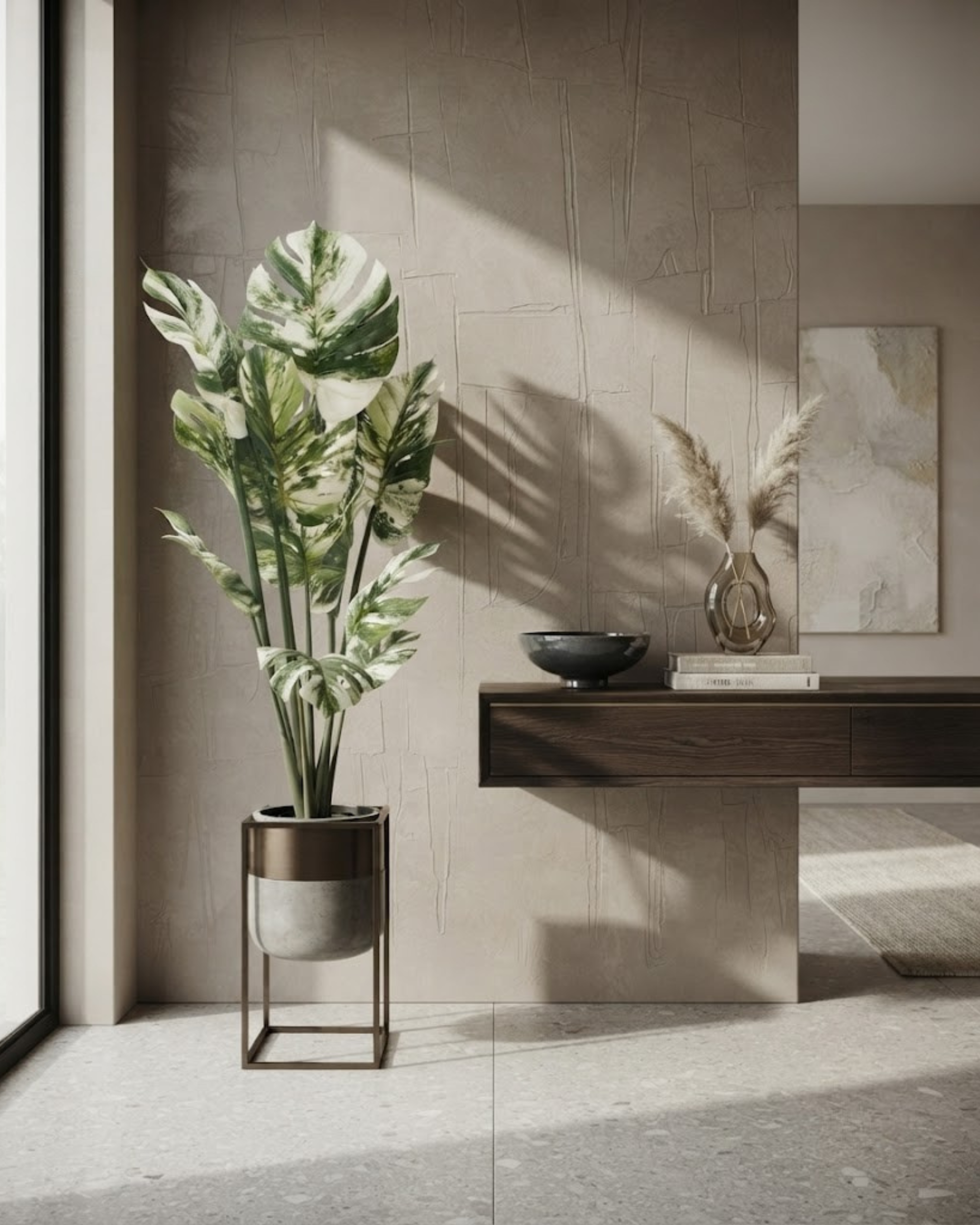 Large artificial plant in a ribbed pot with a metal stand and variegated leaves