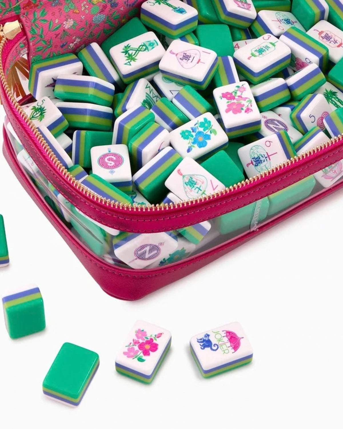 Mahjong tiles in a zippered case; white tiles with green/blue stripes and floral icons