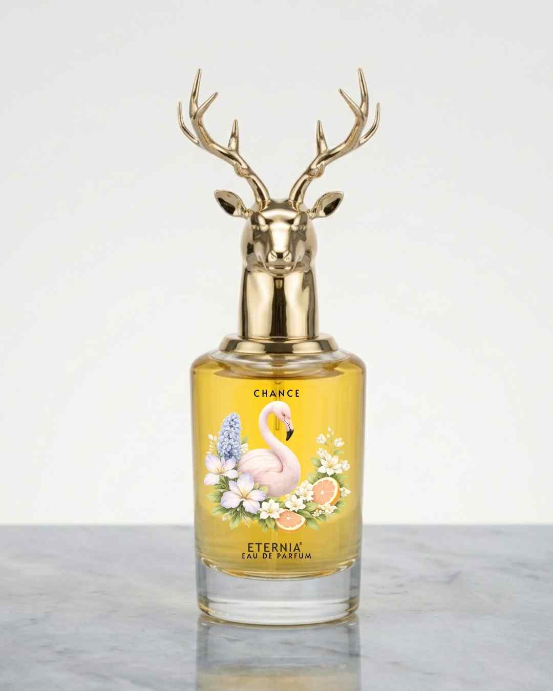 Floral perfume bottle with deer antler gold cap and amber glass, label reads 'Chance'.