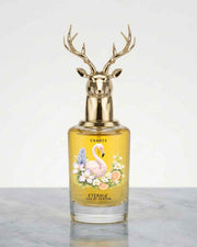 Floral perfume bottle with deer antler gold cap and amber glass, label reads 'Chance'.