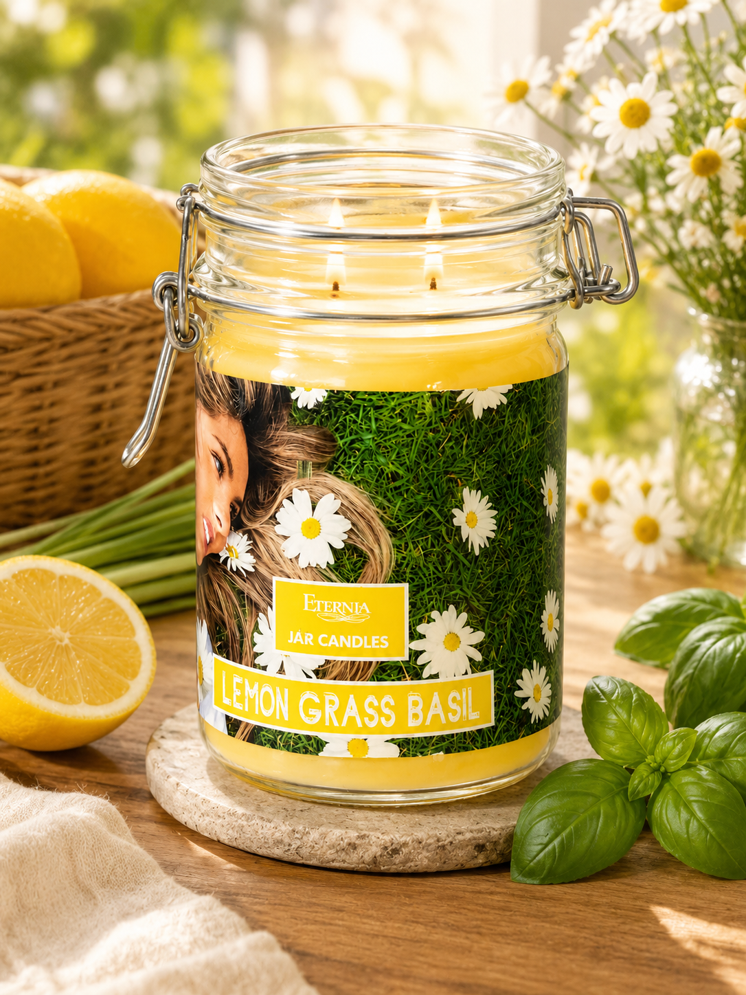 Clear glass jar candle with metal lid and label, lit flame above green wax