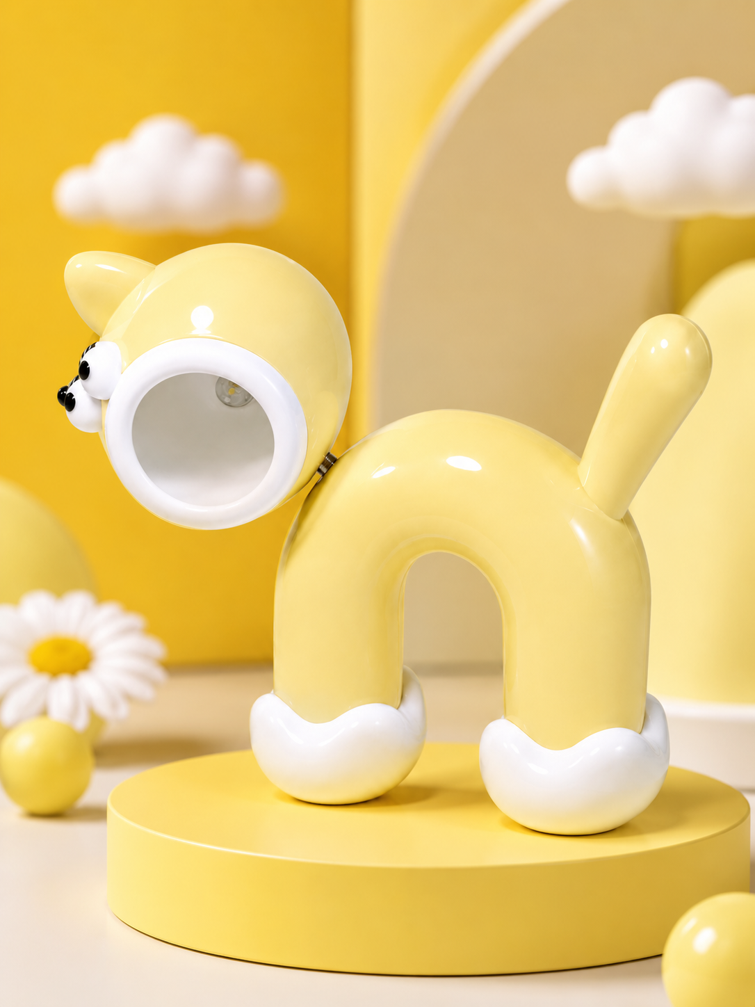 Cute cat LED night light in yellow silicone with glowing round lamp opening and small cat face.