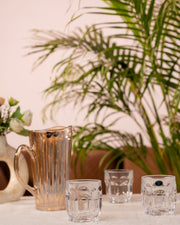 Glass water jug and crystal tumbler set with faceted tumblers, amber tone