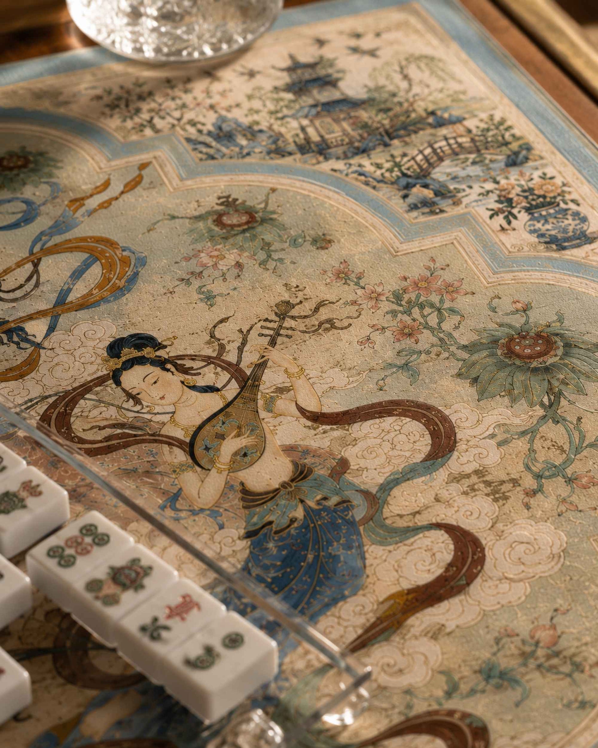 Close view of square game mat with blue-and-cream vintage pattern and Mahjong tiles