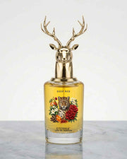Eternia Deep Red eau de parfum bottle with gold deer antler cap, floral label