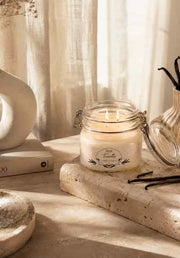 Eternia vanilla scented jar candle in a clear glass jar with metal clasp lid