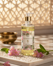 Clear amber liquid handwash in frosted pump bottle with floral label