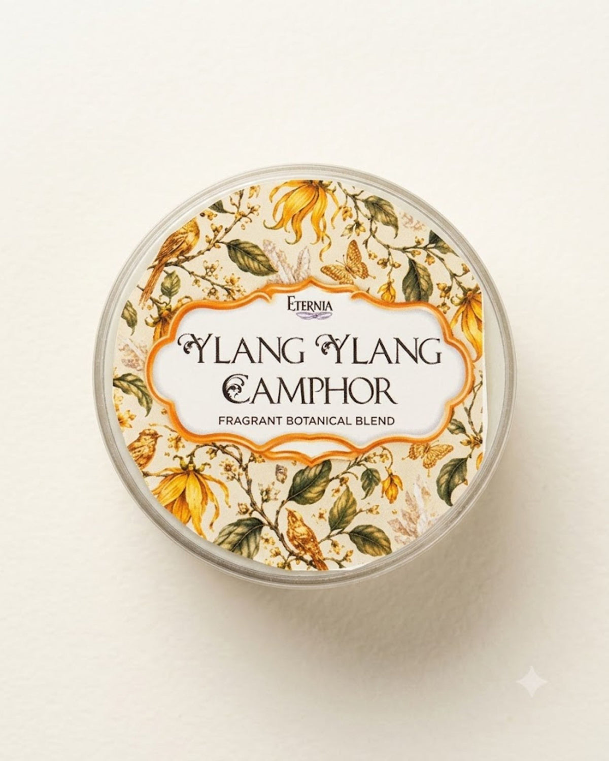 Round jar lid with botanical design and Ylang Ylang Camphor blend branding