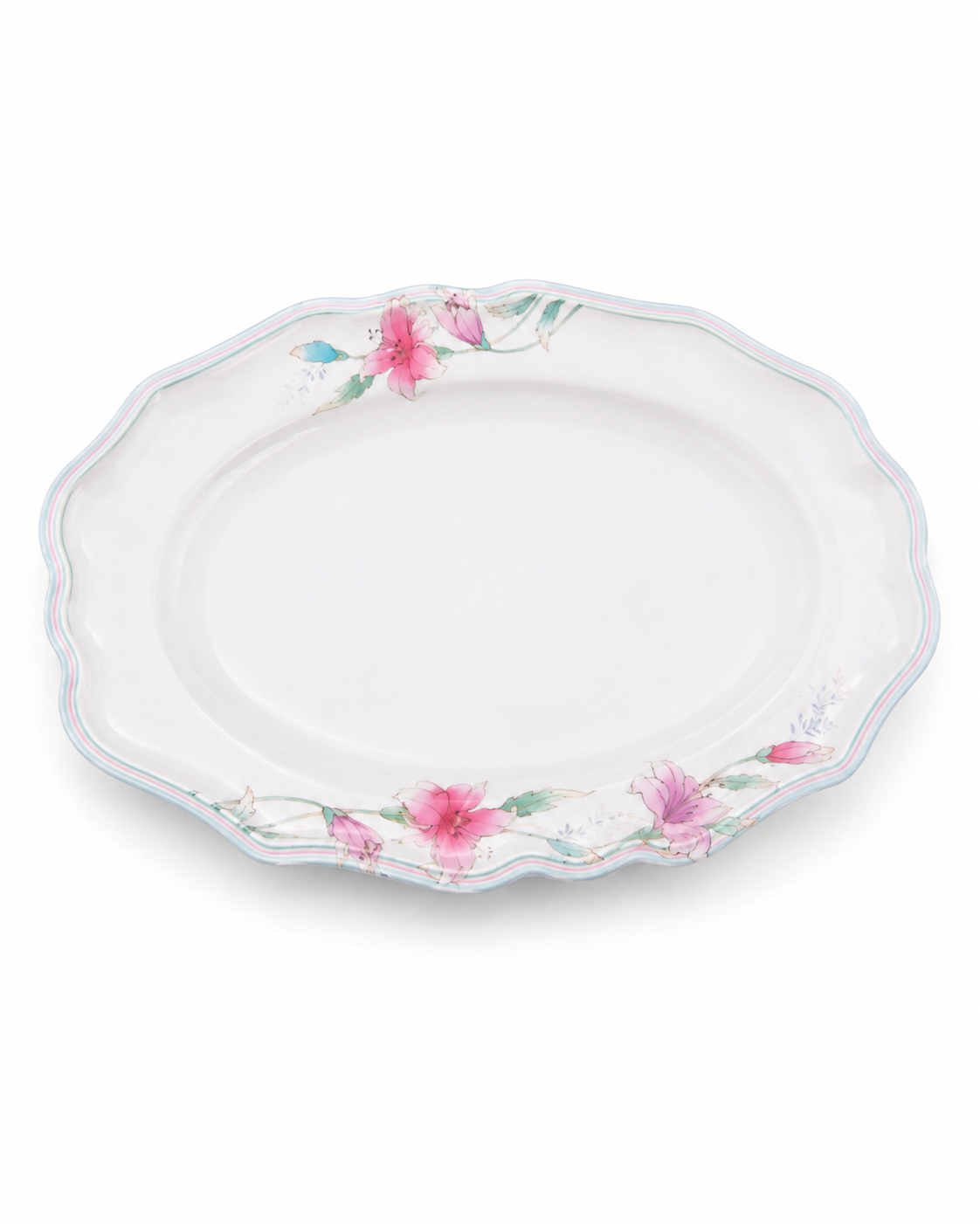 White oval melamine serving plate with pink and green lily blossom edge, scalloped rim.