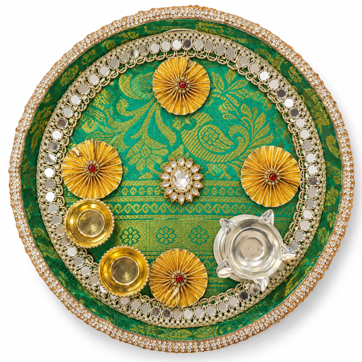 Round festive pooja thali with green patterned base, gold floral accents, and silver diya-like holders