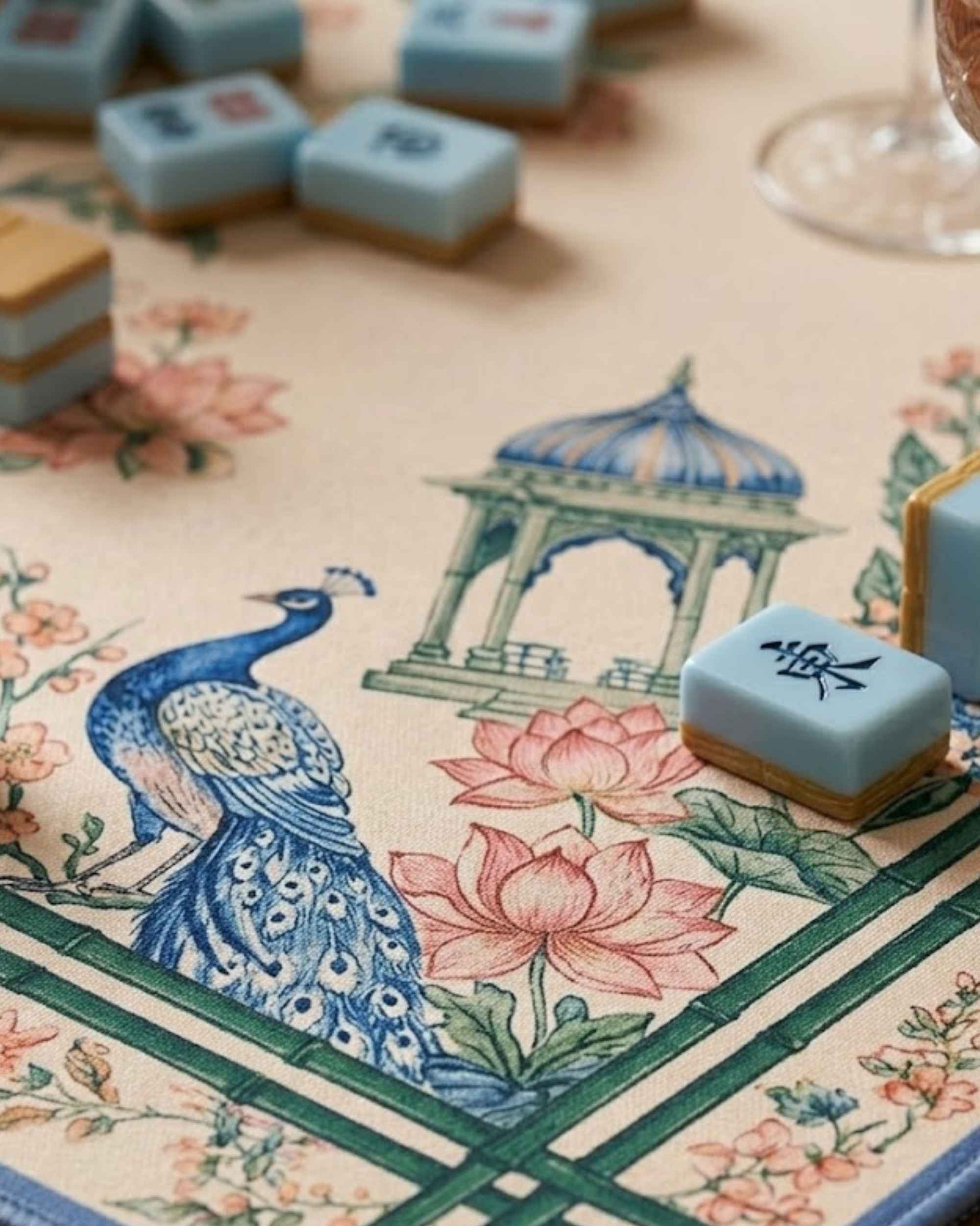 Square mat close-up with peacock and lotus flowers in blue, pink, and cream