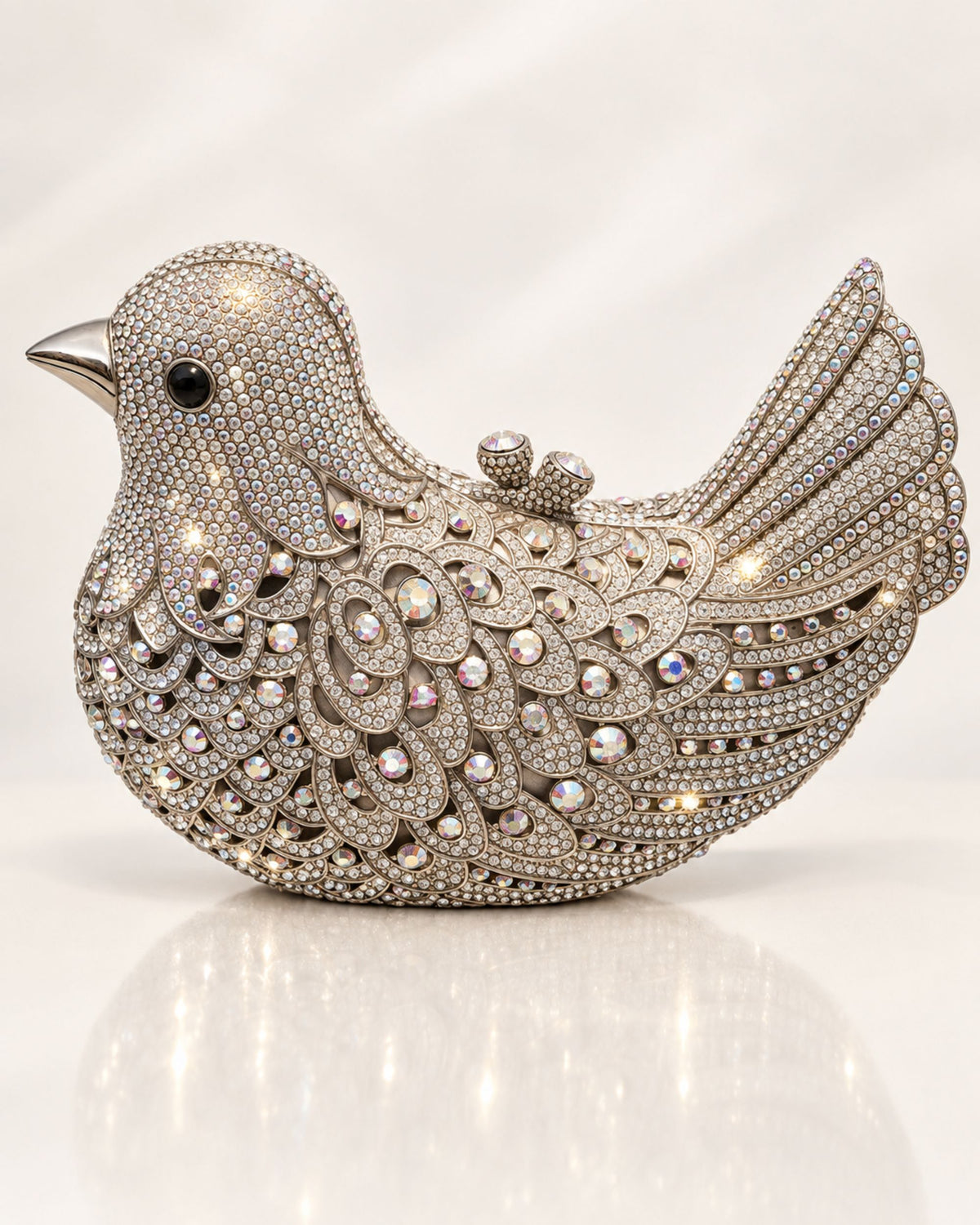 Eternia silver crystal bird clutch, rhinestone-encrusted design with beaded tail