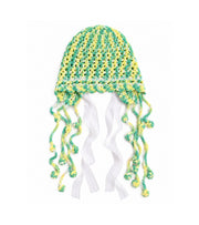 Green and yellow crochet cap with lace edge and long tassel ties