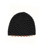 Black knit crochet cap with textured stitch pattern and beaded edge detail
