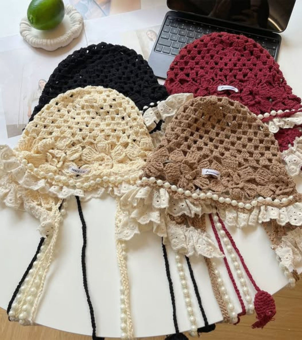 Crocheted lace caps with pearl tassels in black, beige, red, and light brown