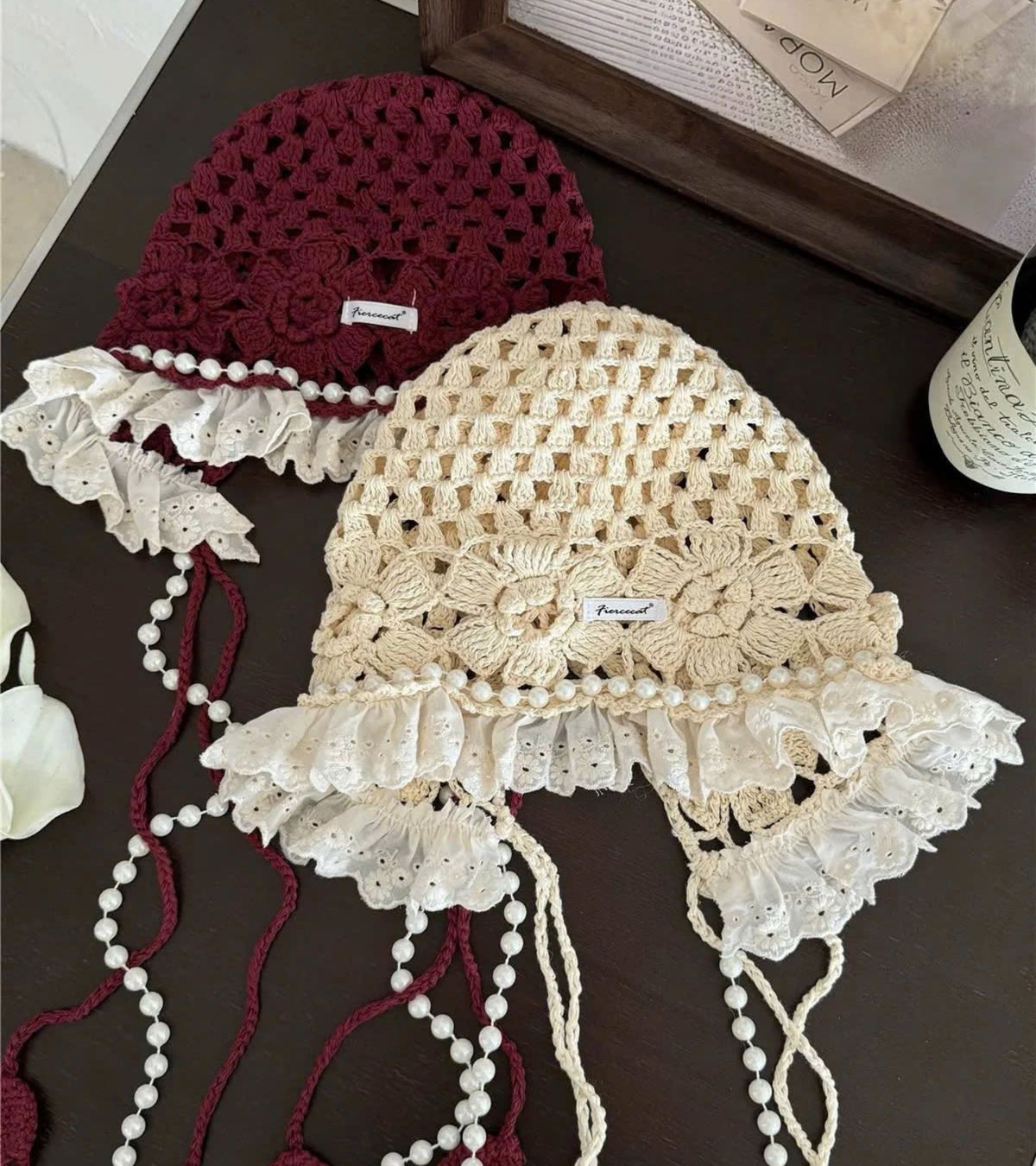 Eternia® red and cream lace caps with white lace ruffles and pearl tassels