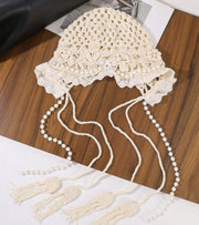 White lace crochet cap with pearl bead tassels and dangling strands