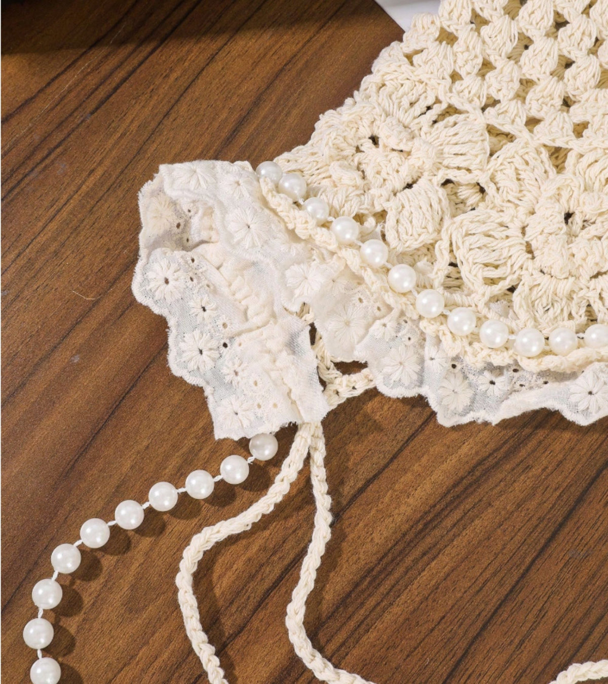 White lace cap detail with faux pearl trim and beaded tassel strand