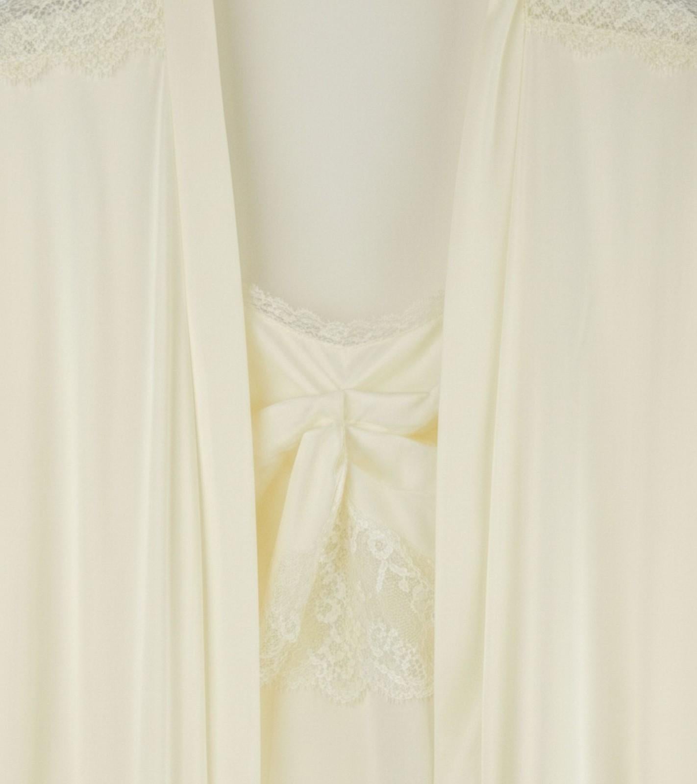 Cream robe front close-up with bow tie and lace panel detailing