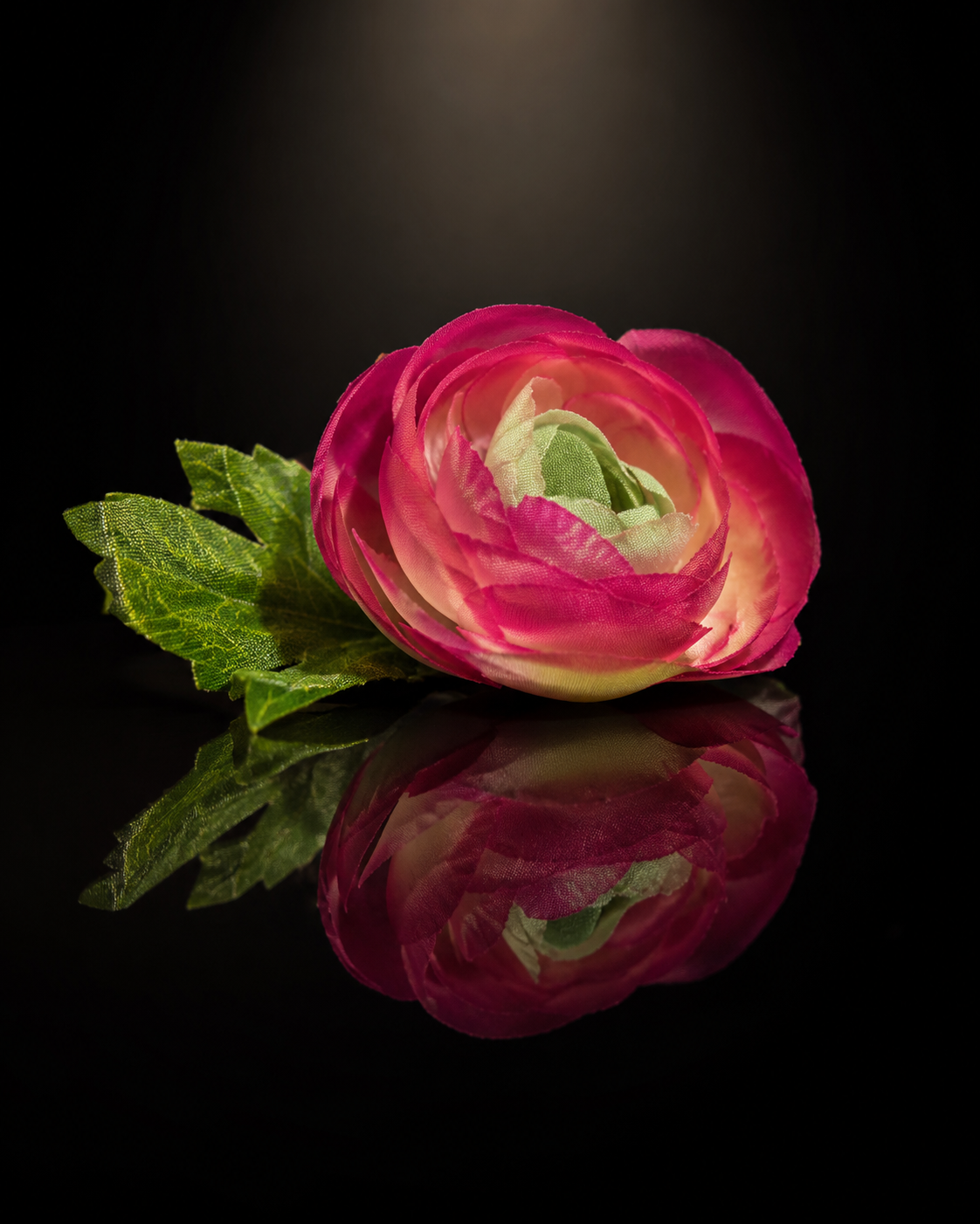 Pink artificial floating flower with green leaves, single bloom for floating decor