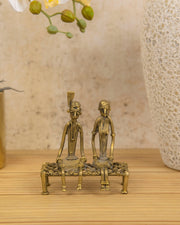 Premsons® Brass Figurine – Tribal Couple Sitting on Charpoy | Handcrafted Decorative Sculpture for Home & Office Décor
