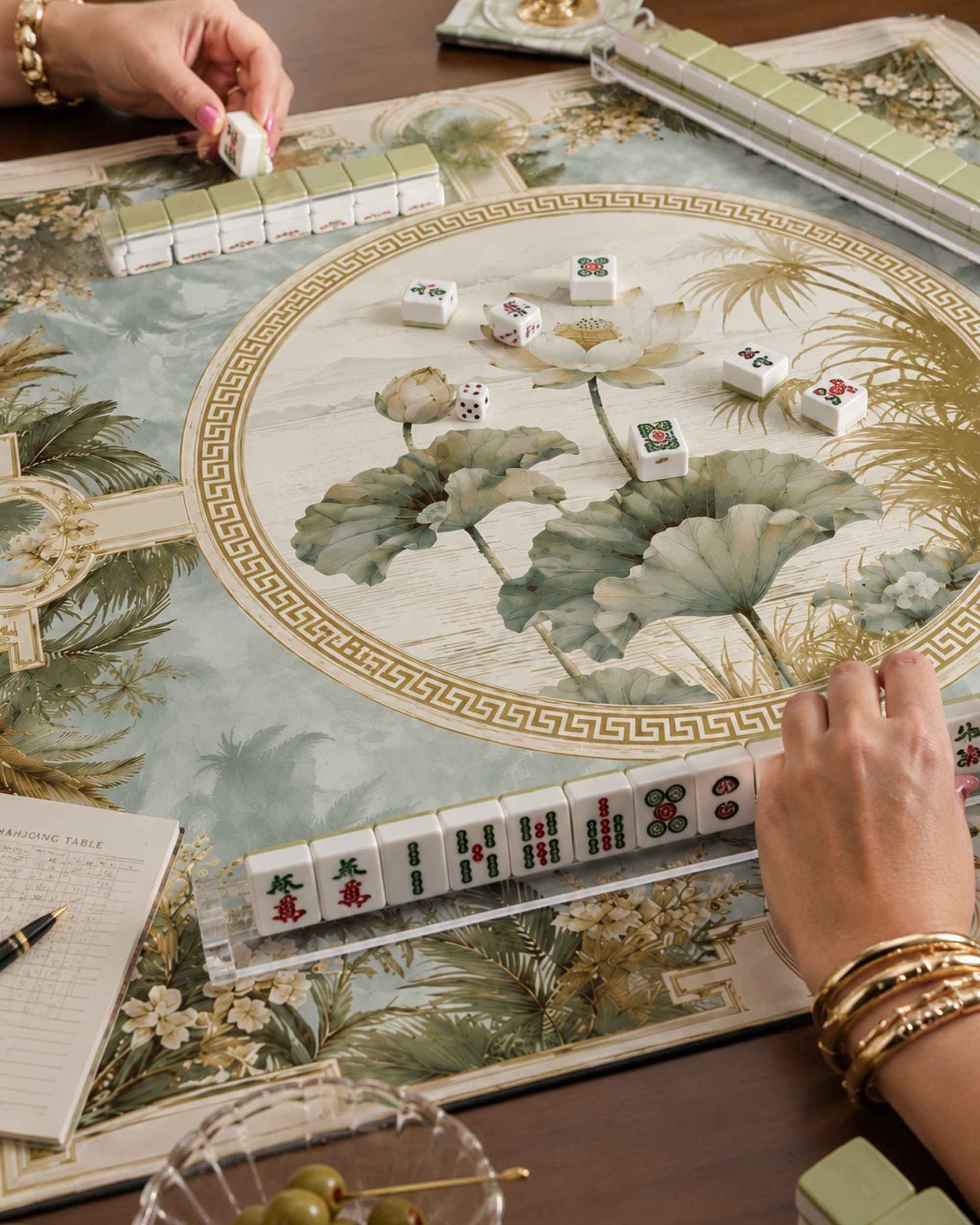 Square gaming table mat detail with gold Greek-key border and lotus leaf print