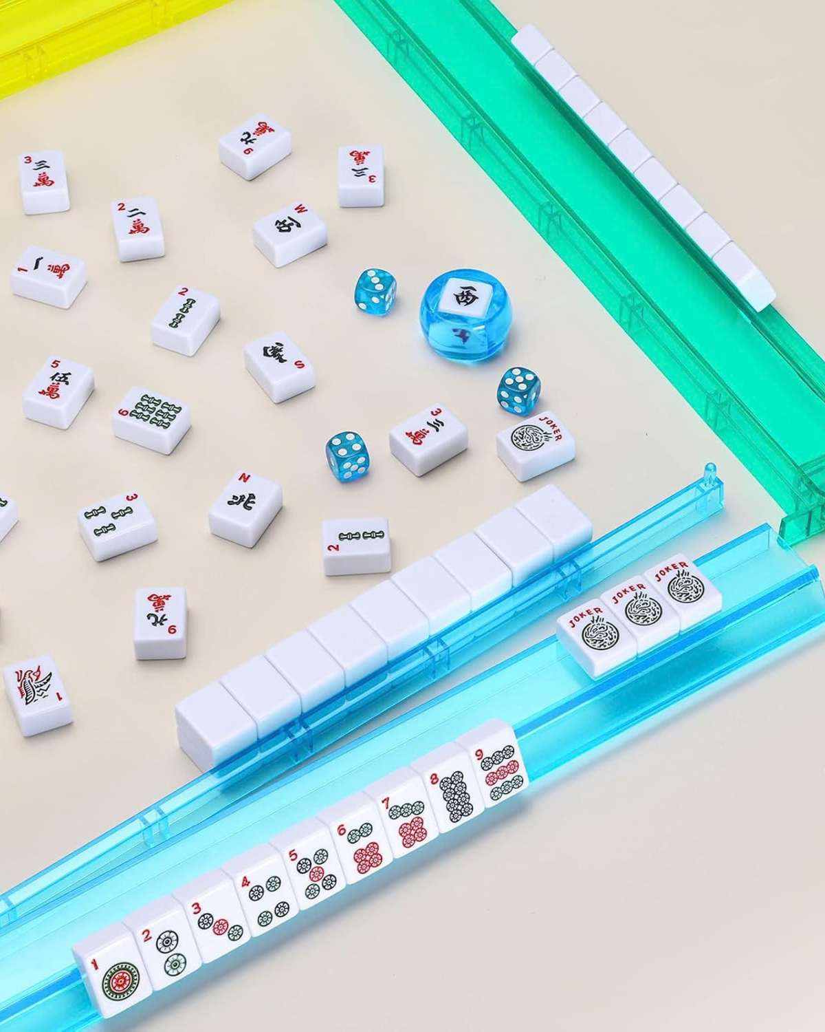 Blue acrylic mahjong rack with tile guide and scoring strip, with dice and tiles
