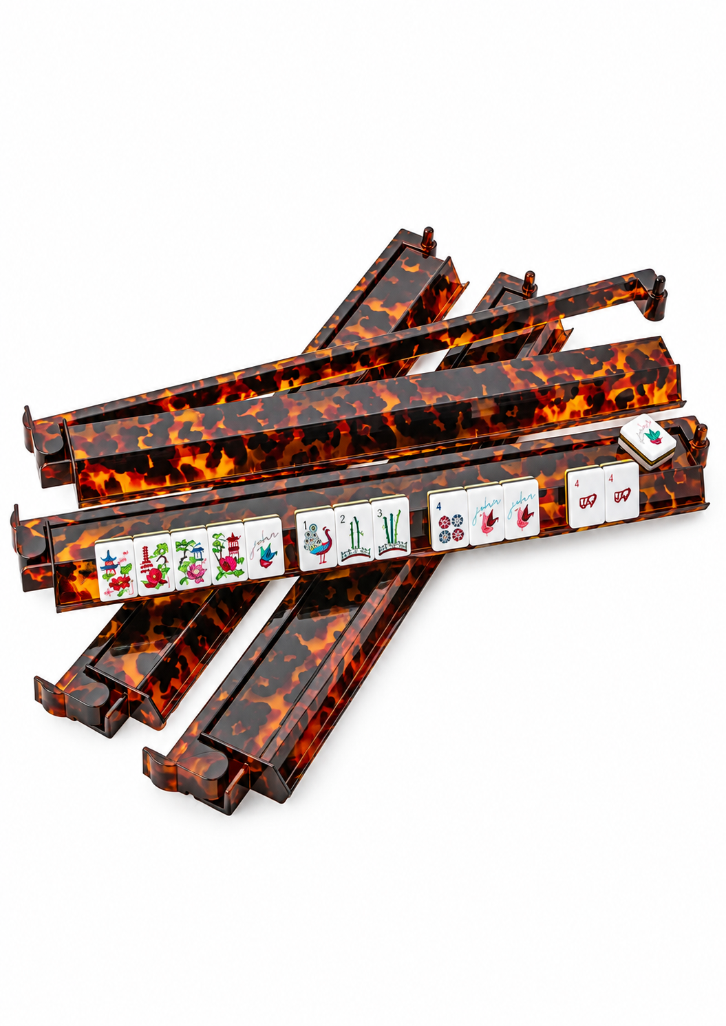 A set of rectangular mahjong tile racks with a glossy tortoiseshell pattern in amber, orange, and black, shown on a clean white background. Several tiles are displayed on top of the racks.