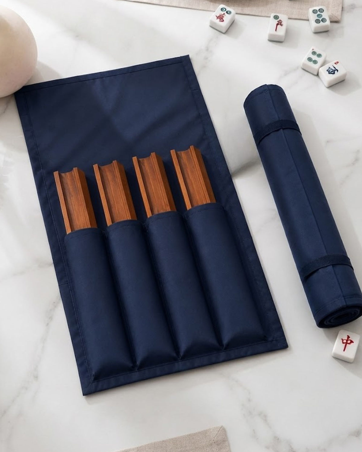 Dark blue mahjong rack cover with wooden slot bars and elastic pockets; rolled cover