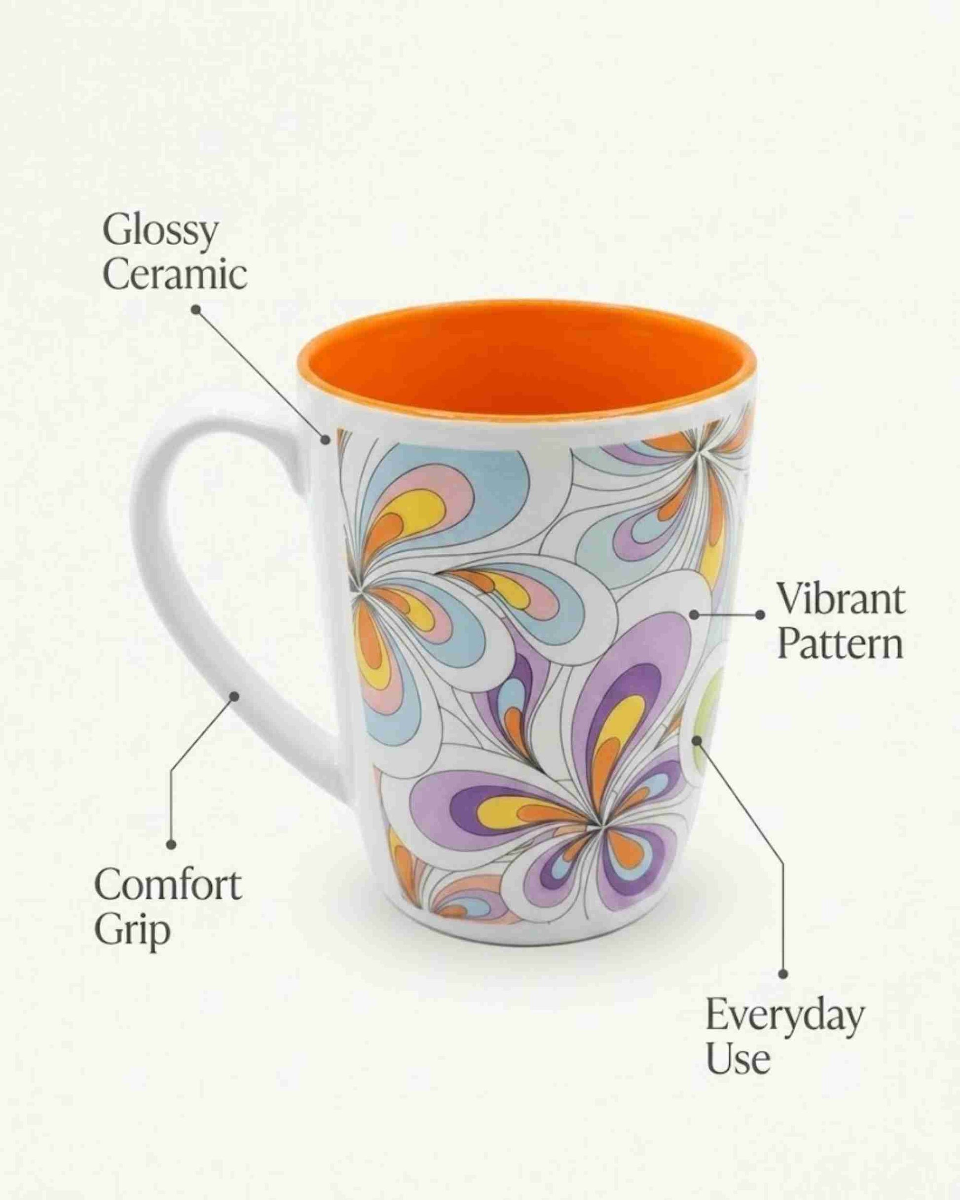 Ceramic coffee mug with handle, glossy, orange rim and colorful floral pattern