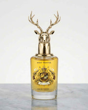 Eternia Most Wanted eau de parfum bottle with gold deer-antler cap and amber liquid