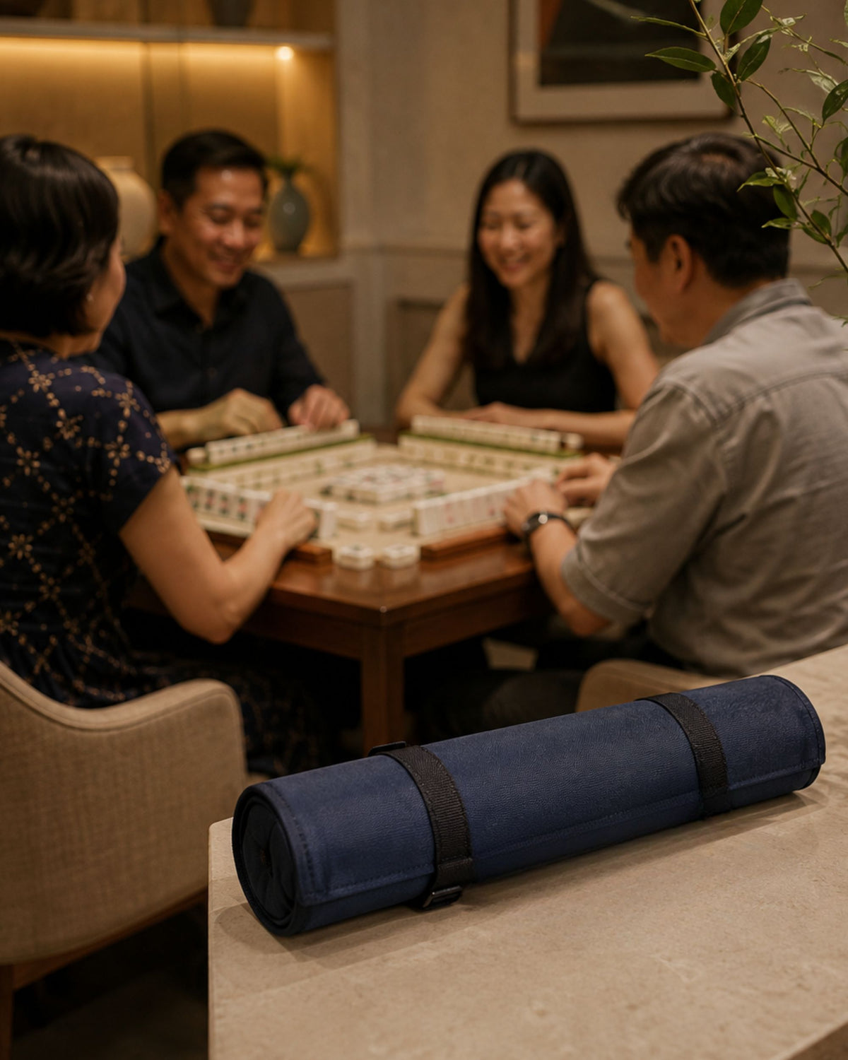 Rolled dark blue mahjong rack cover on tabletop with fabric tie strap