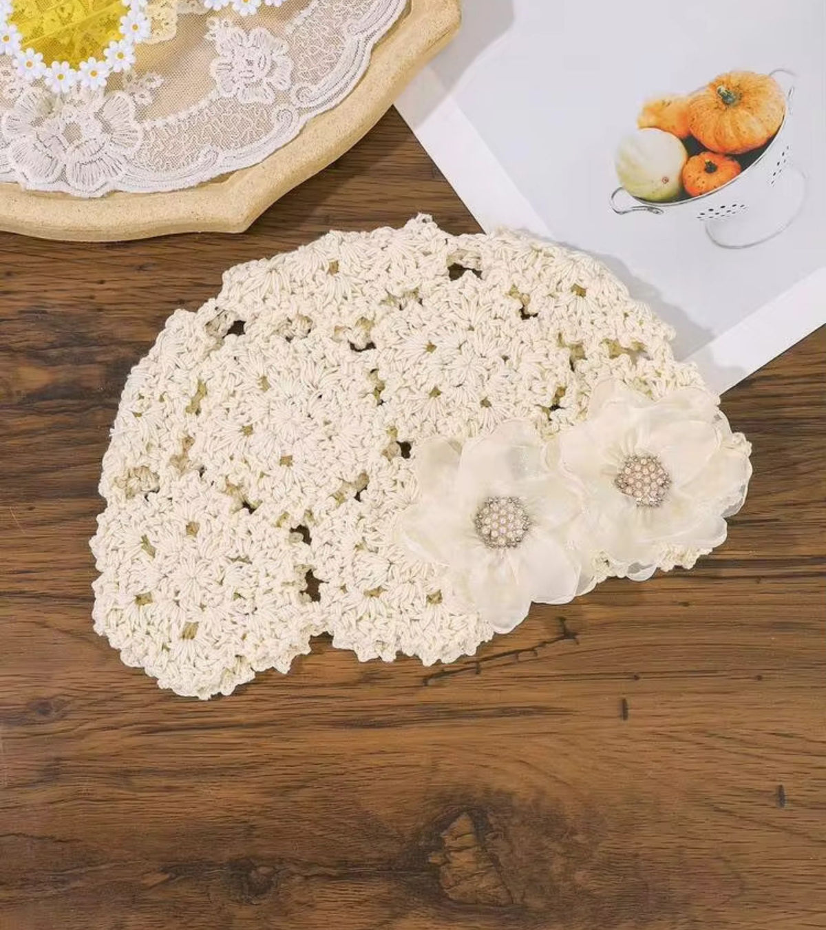 Cream crochet lace bucket cap with layered organza flower appliques and scalloped brim