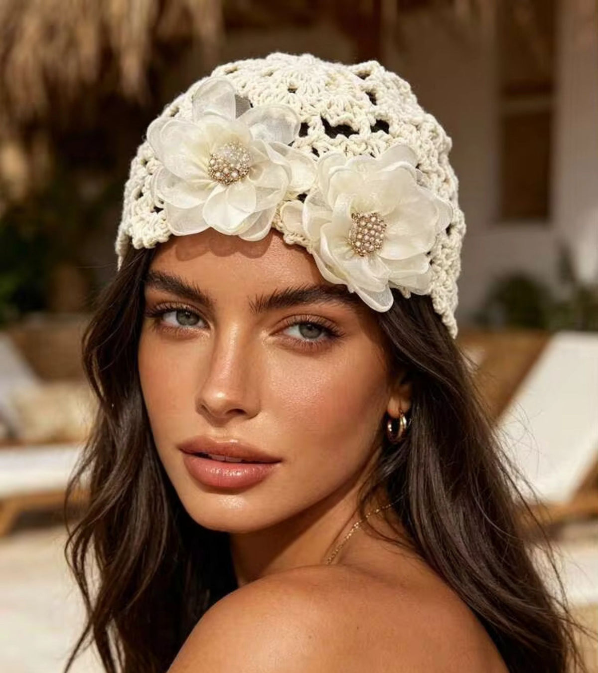 Cream crochet bucket cap with three organza flower clusters and jeweled centers
