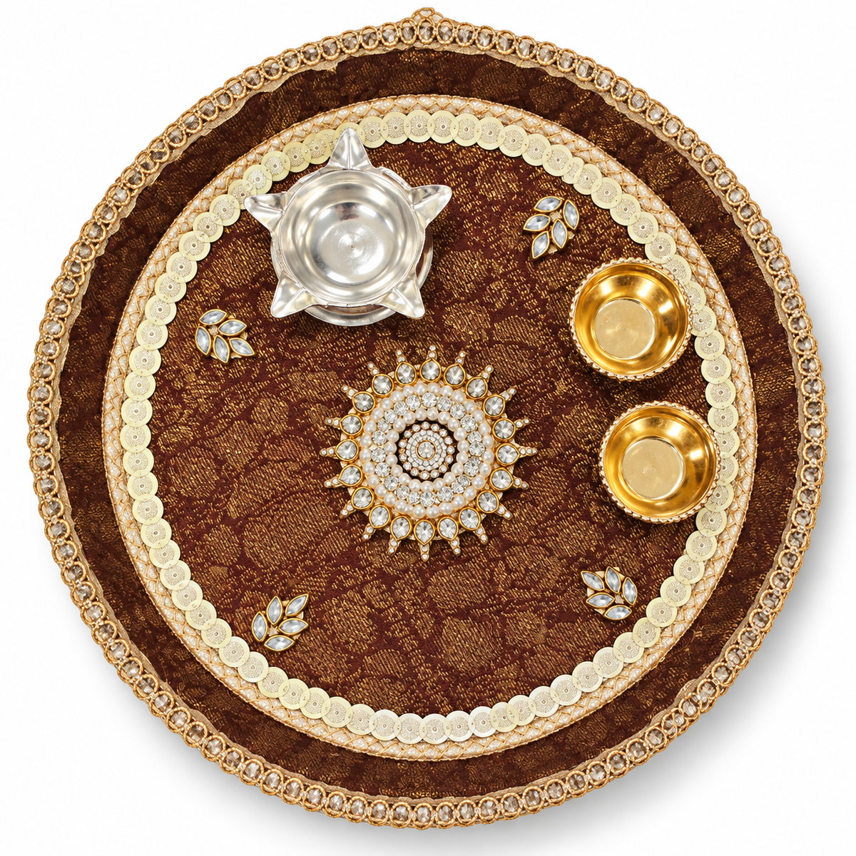 Ornate brown pooja thali with golden beaded rim, central flower, silver diya, two gold diyas