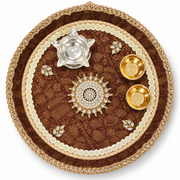 Ornate brown pooja thali with golden beaded rim, central flower, silver diya, two gold diyas