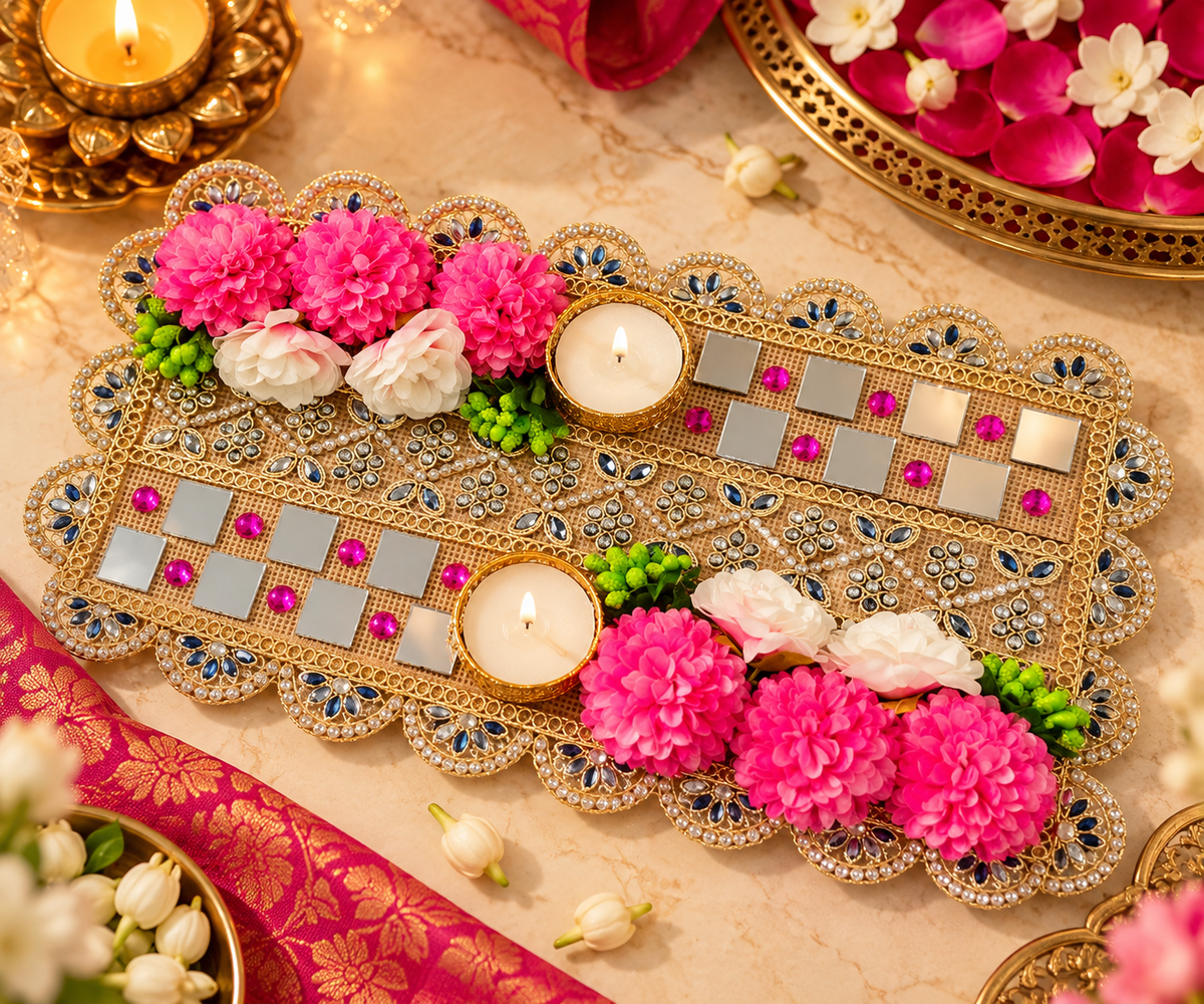 Ornate pooja tray with tealight holders, jeweled border, and pink and green floral accents