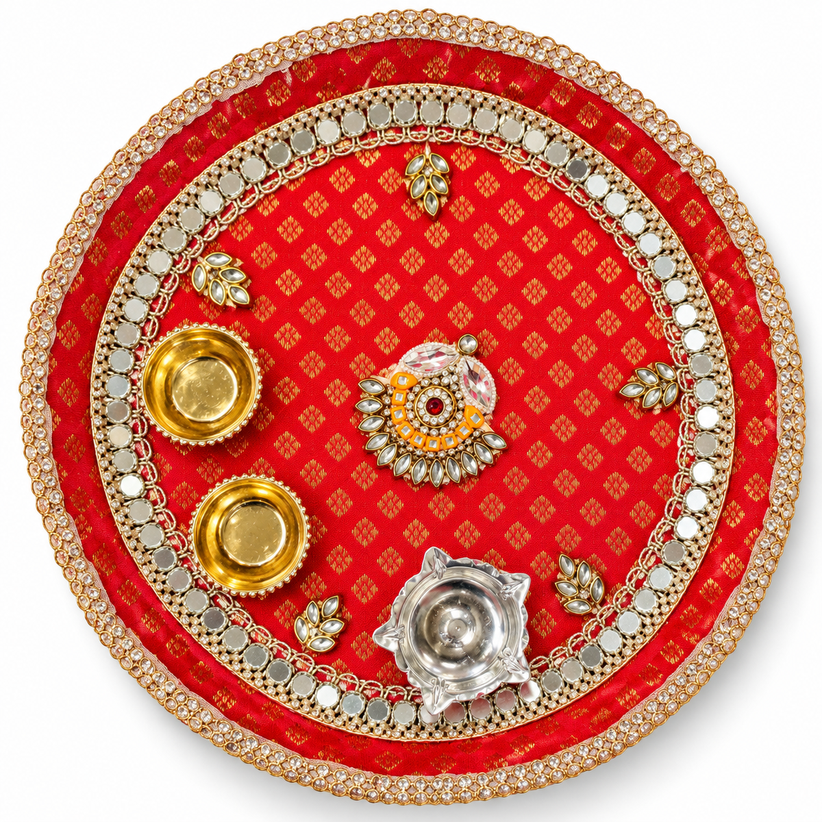 Round red and gold pooja thali with decorative stones and brass diya holders