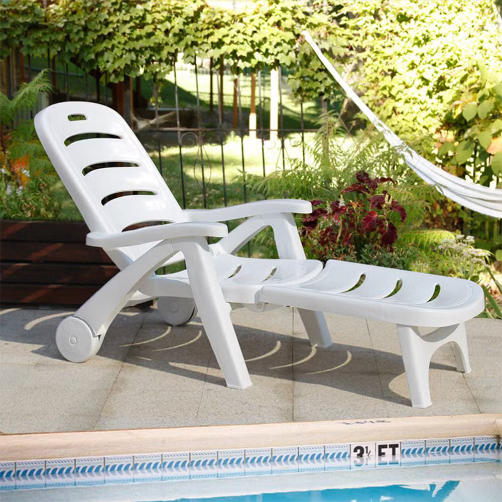 White plastic adjustable chaise lounge with three recline positions and slatted seat
