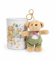 Ceramic coffee mug with illustrated bears, plus plush teddy keychain in green sweater
