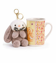 Floral ceramic mug with rabbit plush keychain charm and bunny bow detail