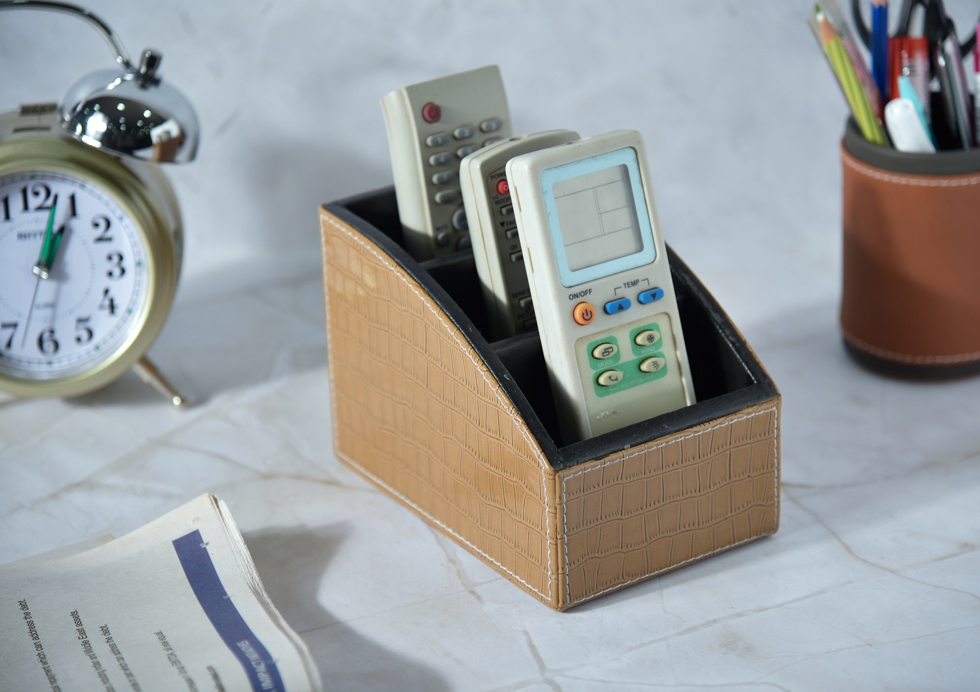 Beige croc-texture remote holder with 3 compartments; holds TV remote