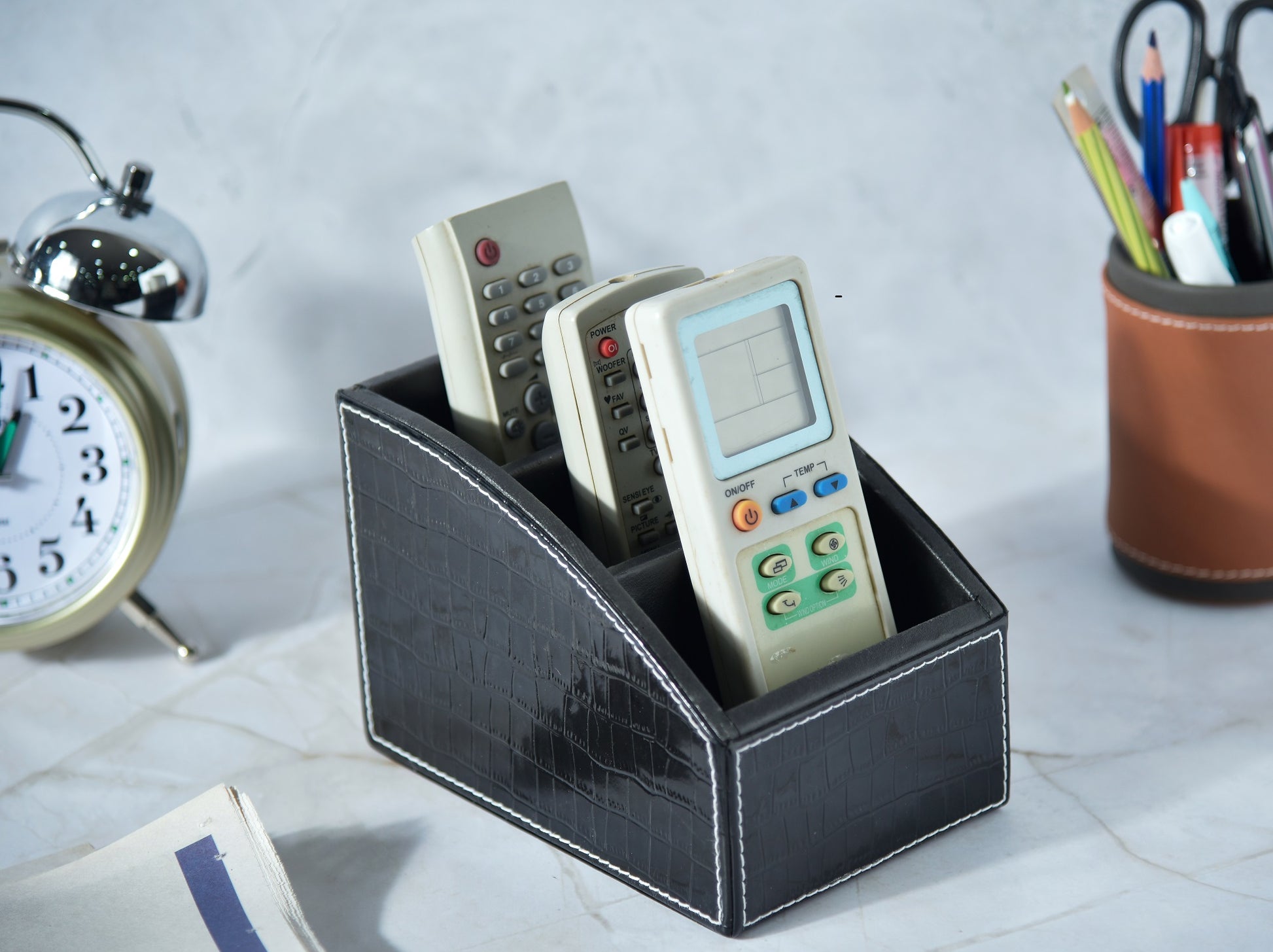 Black croc-texture remote holder with 3 compartments; holds multiple remotes