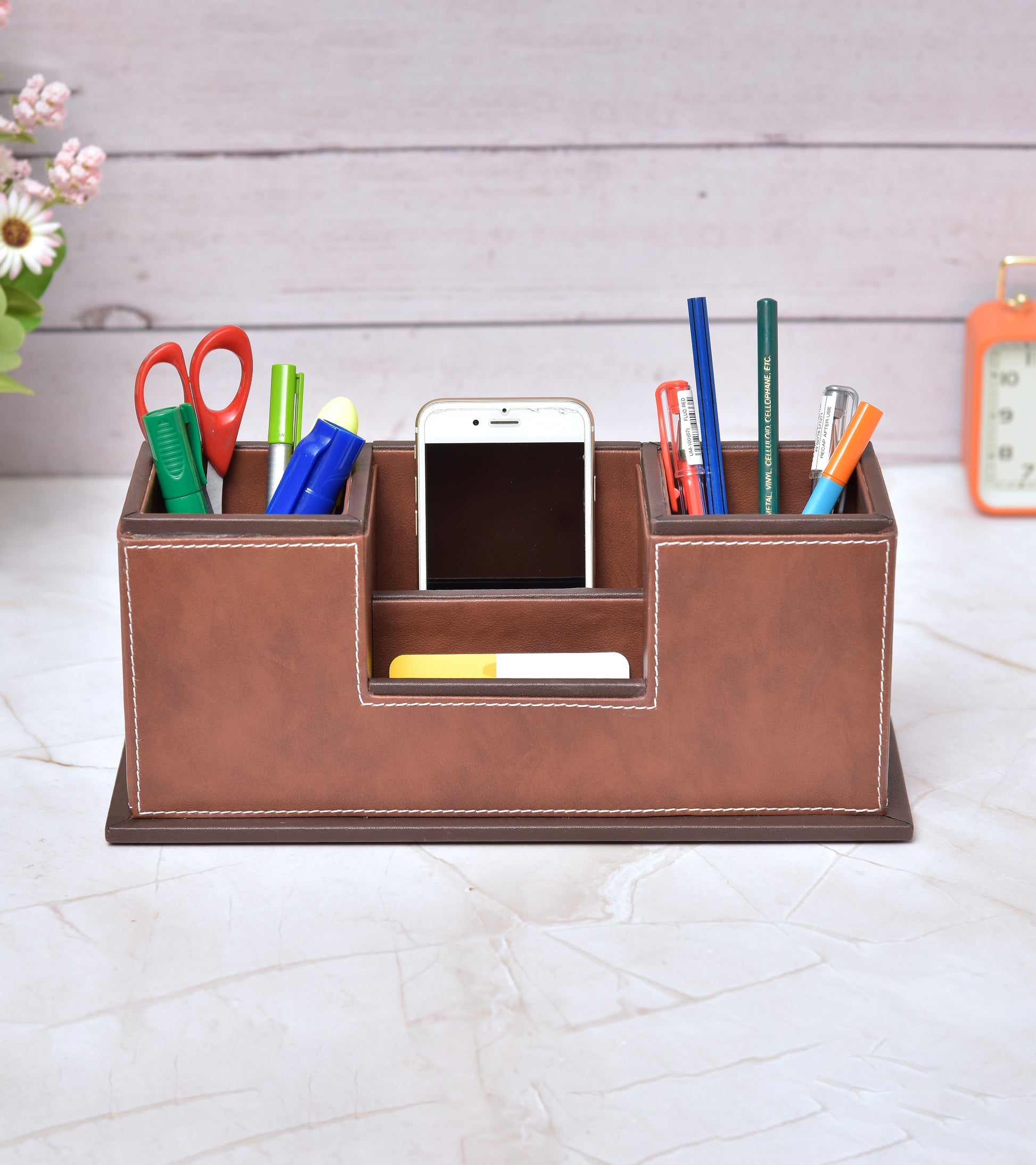 Two-compartment desk organizer with central divider, brown faux leather look with pens and notes