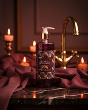 Burgundy luxury handwash bottle with gold pump and Noble Burgundy label